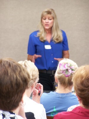 Susan Grogan begins her demonstration utilizing gesso on watercolor paper.